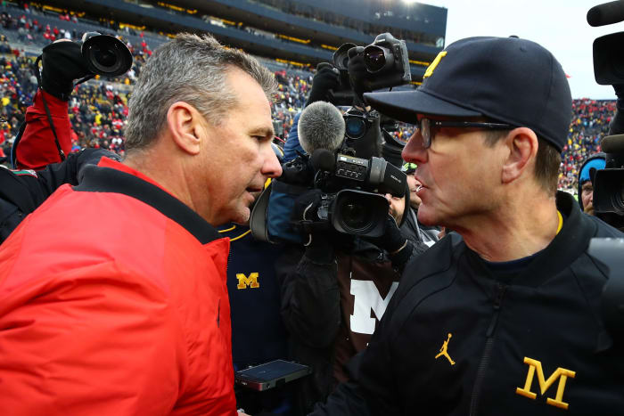 Urban Meyer talking to Jim Harbaugh after the Ohio State, Michigan game