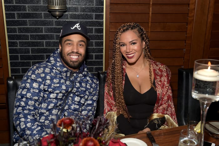 Ros Gold-Onwude sits with a guest at an award show.