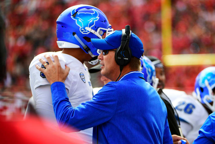 Lance Leipold congratulates Buffalo player. He's expected to be hired as the next Kansas football coach.