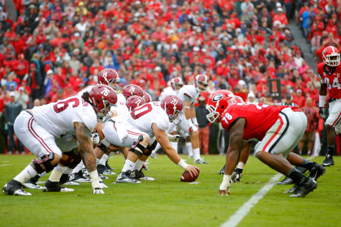 Alabama's offense lined up against Georgia's defense in a college football SEC game.