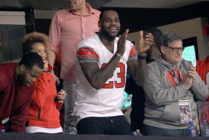 LeBron James celebrating while watching an Ohio State Buckeyes football game.
