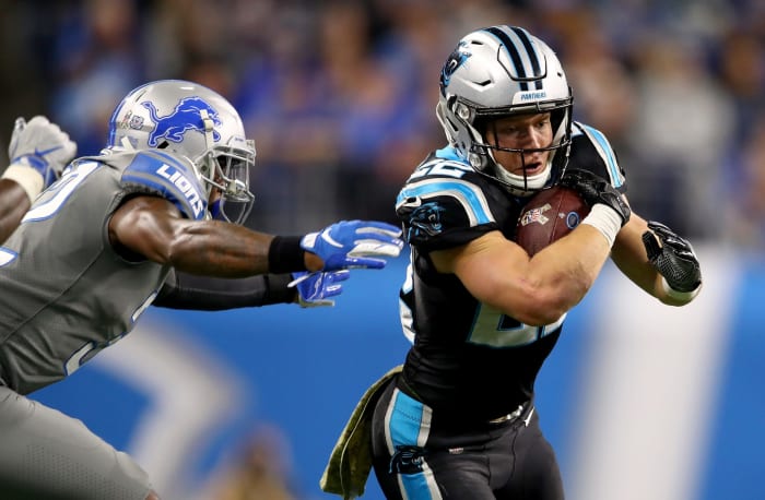 Christian McCaffrey runs the ball for the Carolina Panthers against the Detroit Lions.