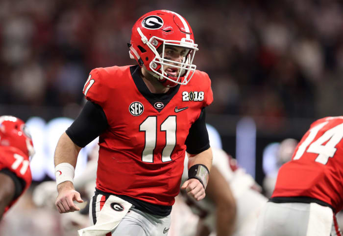 Jake Fromm running onto the field.