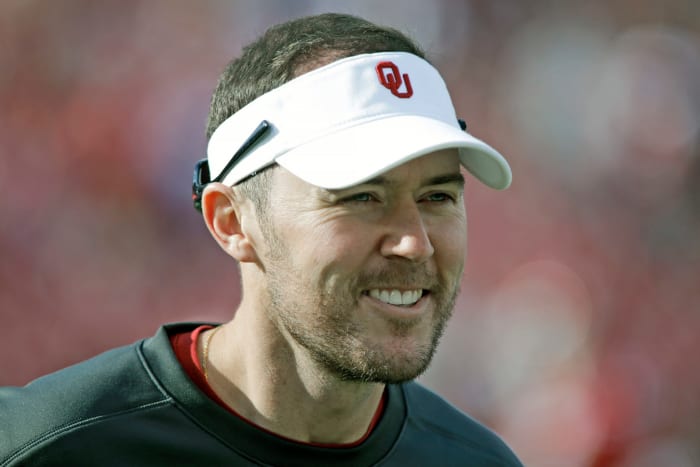 A closeup of Lincoln Riley wearing an Oklahoma Sooners visor.