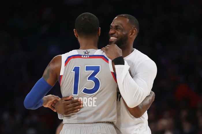 LeBron James and Paul George embrace before the All-Star Game.