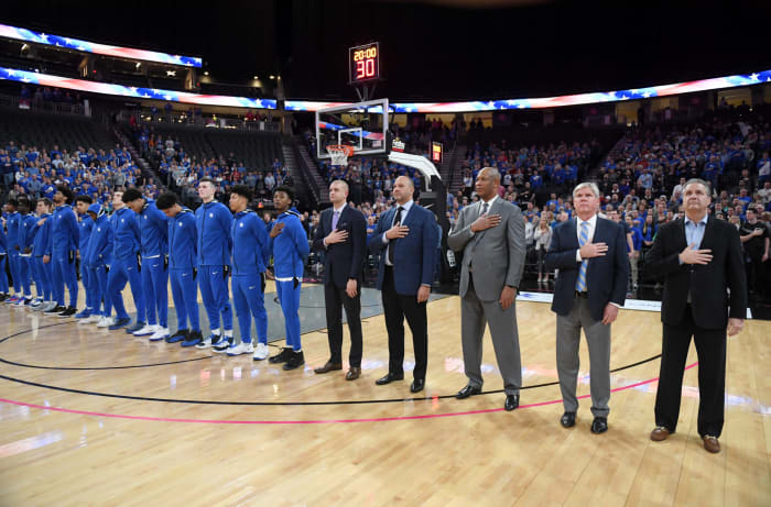 Kentucky's coaching staff including assistant Kenny Payne, now with the New York Knicks, and players lined up.