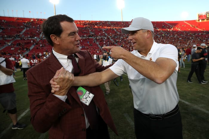 New USC athletic director Mike Bohn and head coach Clay Helton.