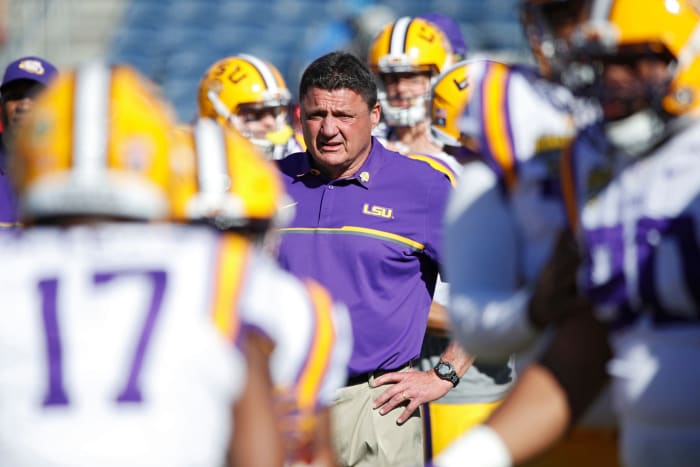 Ed Orgeron watches his LSU Tigers warm up before the Citrus Bowl.