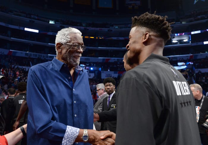 NBA legend Bill Russell talks with Jimmy Butler at the All-Star Game.