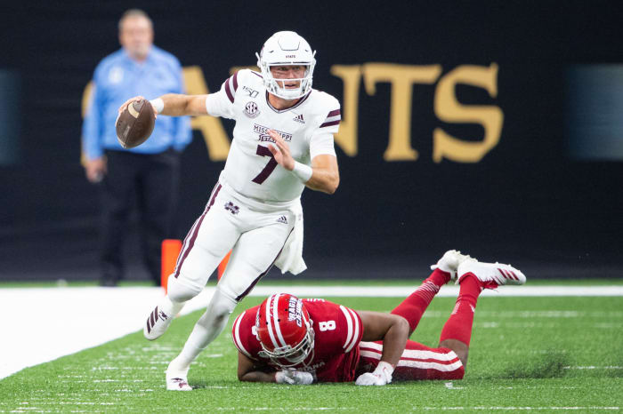 Tommy Stevens escapes a tackler for Mississippi State.