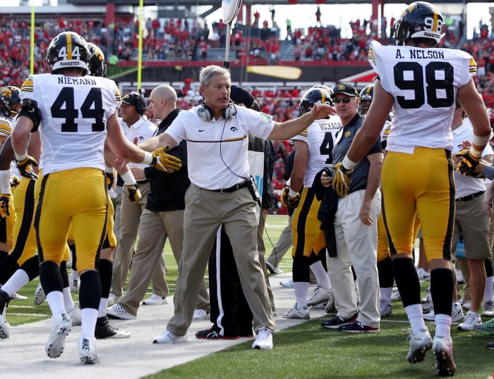 Kirk Ferentz congratulates his Iowa players during game.
