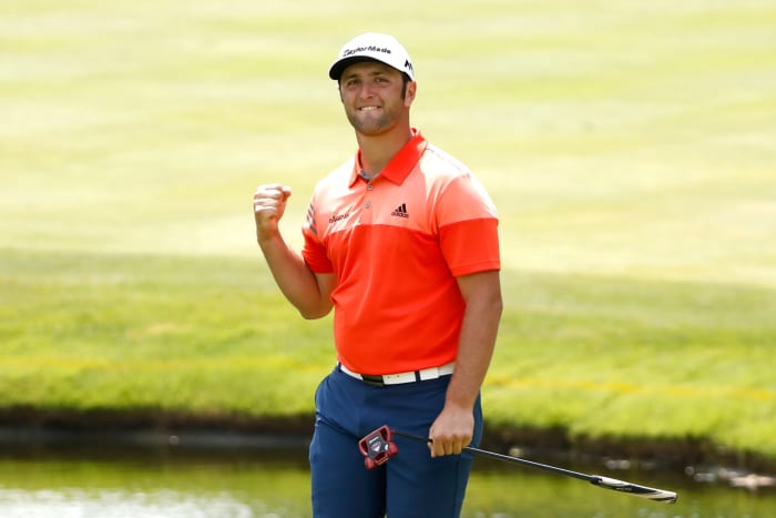 Jon Rahm celebrating during a golf tournament.