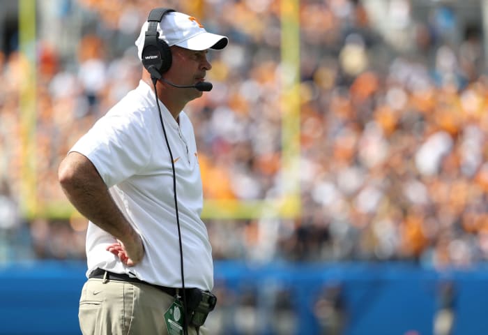 Jeremy Pruitt standing on the sideline.