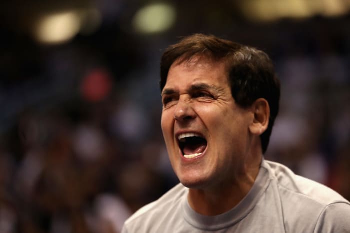 A closeup of Mark Cuban screaming.