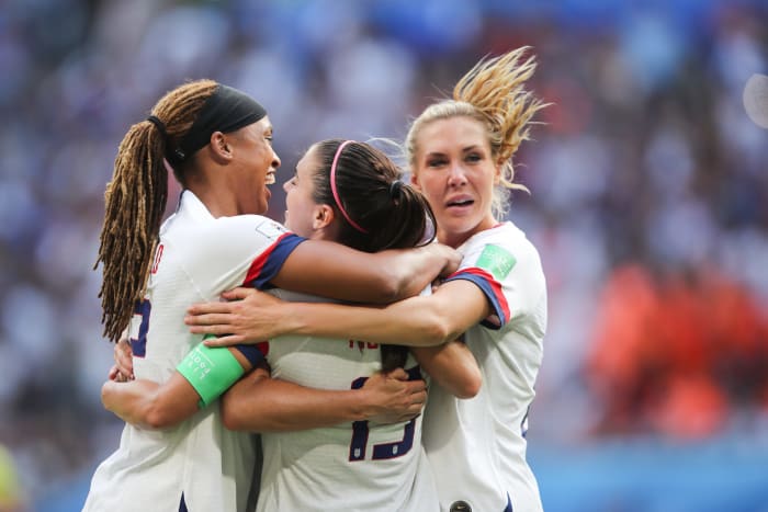 USWNT players celebrate winning the World Cup.