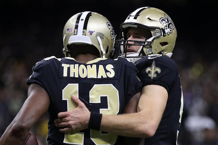 Drew Brees hugs Michael Thomas.