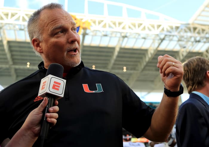 Mark Richt doing an interview during a game.