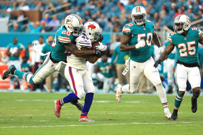 Reshad Jones tackles Lesean McCoy.