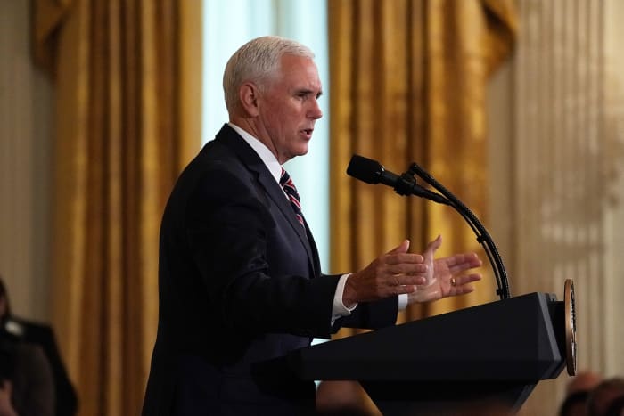 Vice President Pence speaking at a podium.