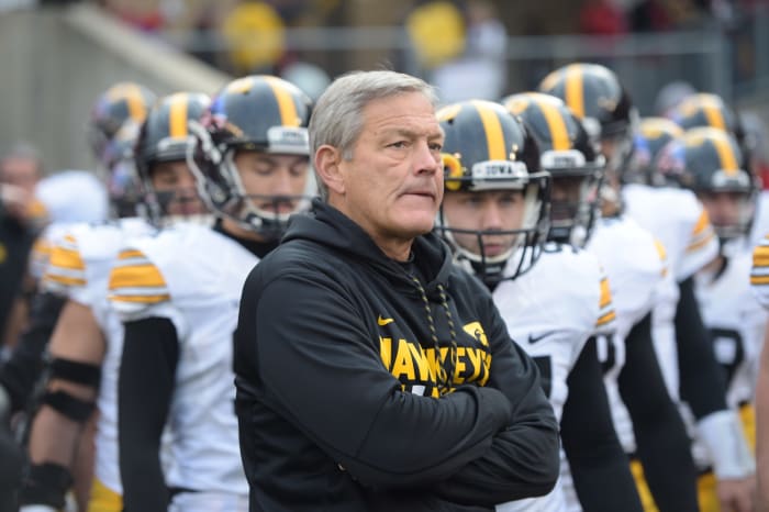 Kirk Ferentz waits with his team before game.