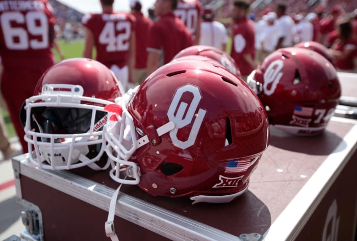 A closeup of an Oklahoma football helmet on the sideline.