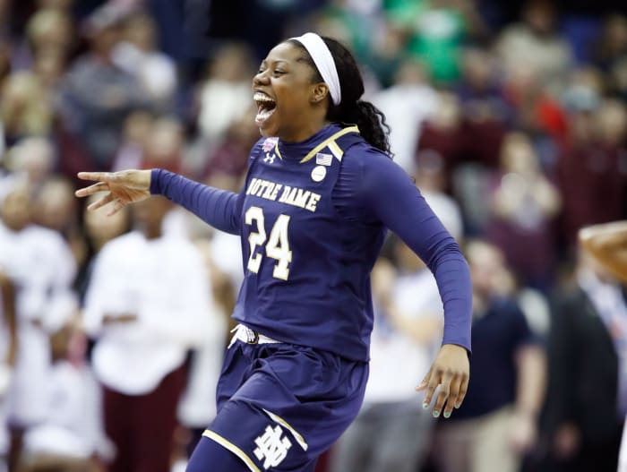 Arike Ogunbowale celebrating after hitting a game-winning basket.