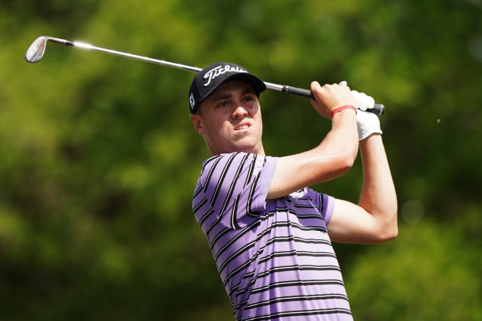 Justin Thomas swinging a golf club.