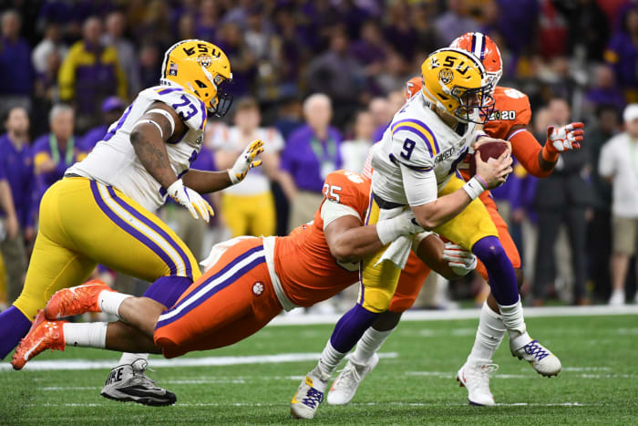 LSU quarterback Joe Burrow runs the ball against Clemson in the national title game.