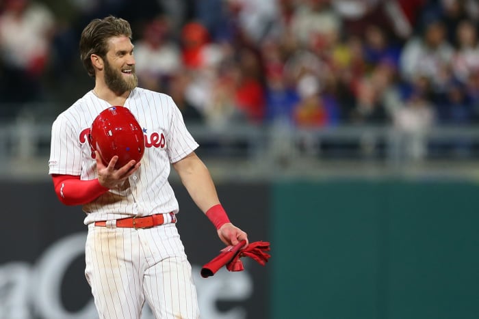 Bryce Harper smiling during a Phillies game.