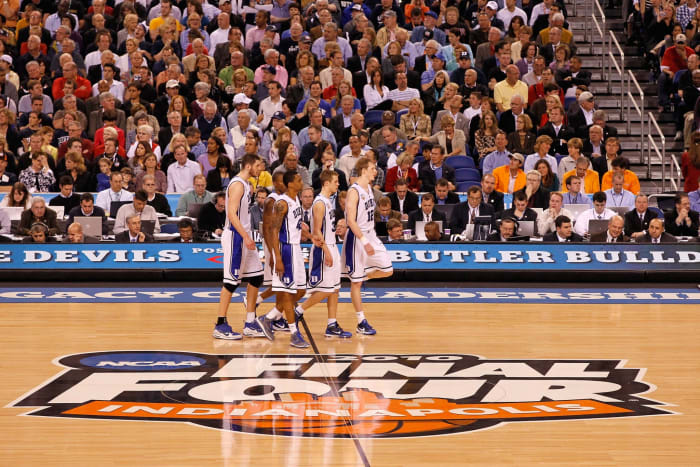 Duke players, including Nolan Smith, walking across the Final Four court.