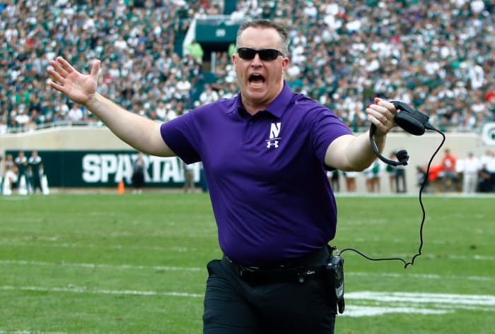A closeup of Pat Fitzgerald yelling during a Northwestern football game.