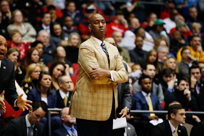 Danny Manning with his arms crossed on the sideline.