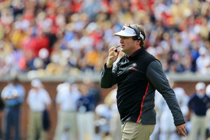 Kirby Smart talking into a headset on Georgia's sideline.