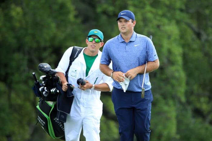 Patrick Reed reacting with his caddie during the Masters.