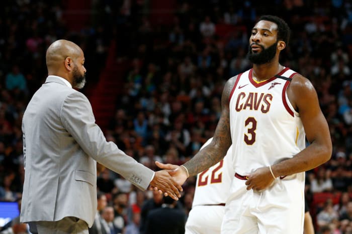 Andre Drummond shakes hands with Cavs head coach J.B. Bickerstaff.