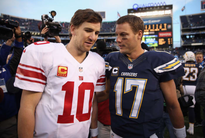 Eli Manning and Philip Rivers shake hands after a game.