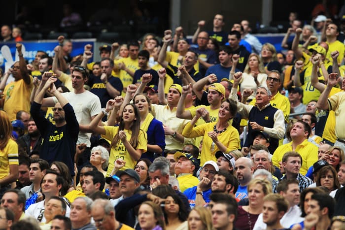 Michigan Wolverines fans cheer in the first half against the Florida Gators during the South Regional Round Final of the 2013 NCAA Men's Basketball Tournament.