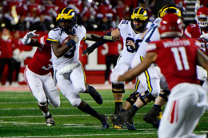 Michigan QB Joe Milton runs against Rutgers.