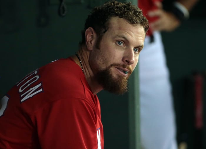 Josh Hamilton sits in the Texas Rangers dugout.