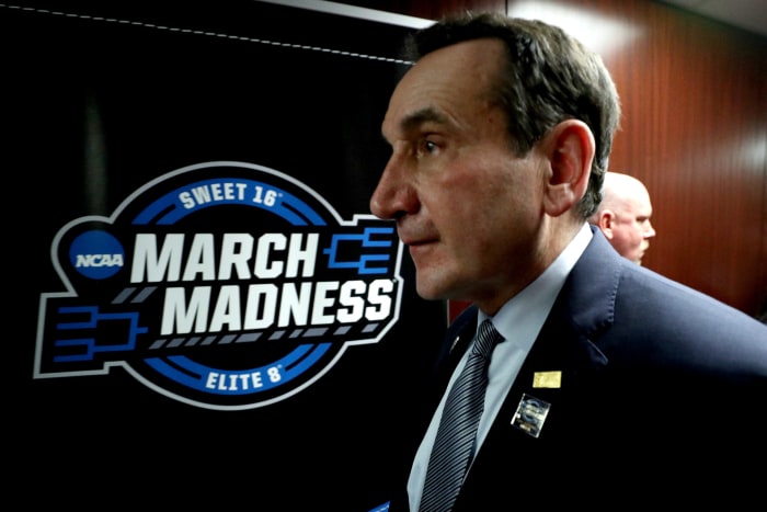 A closeup of Mike Krzyzewski walking in the tunnel during an NCAA Tournament game.