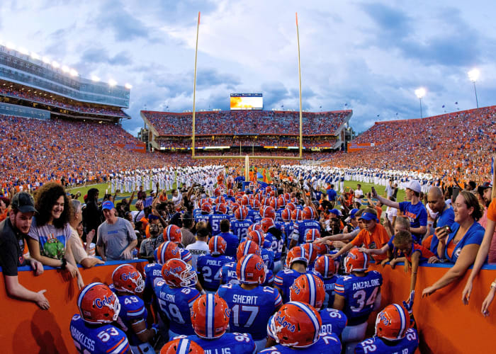 The Florida Gators football team walking onto the field.