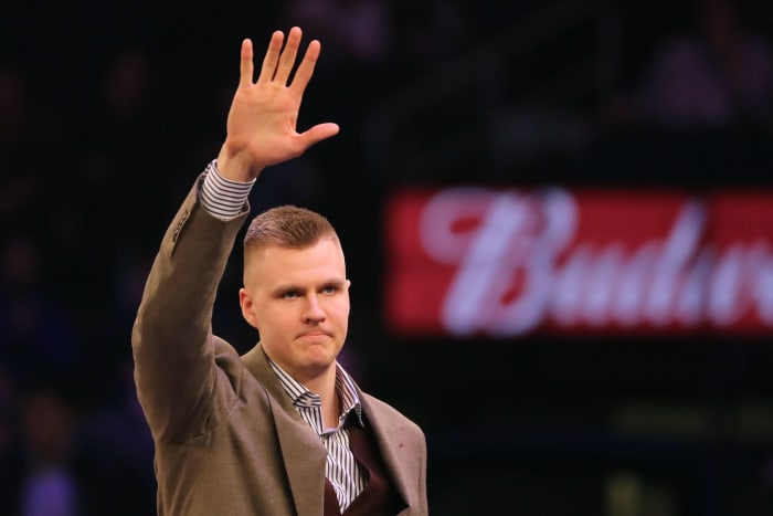 Kristaps Porzingis waving to fans.