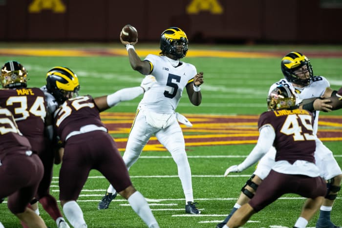 Joe Milton throws the ball for Michigan.