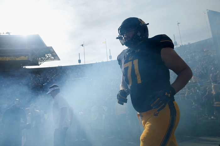 Jake Curhan walking on to the field.