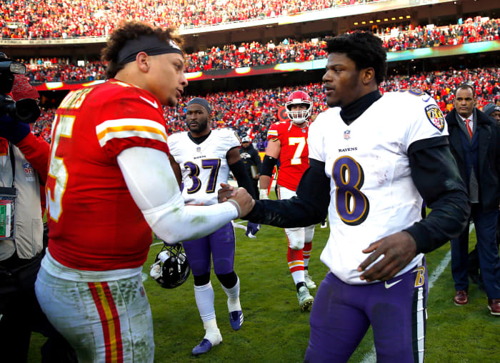 Lamar Jackson shakes hands with Patrick Mahomes.