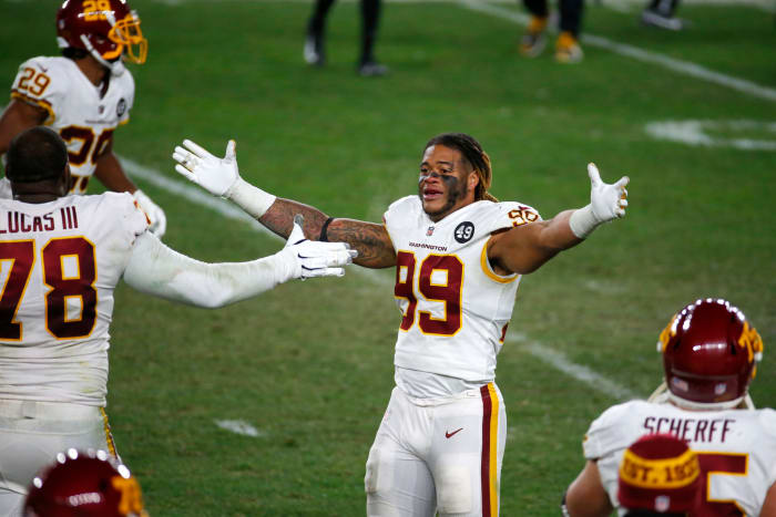 Chase Young celebrates for Washington.