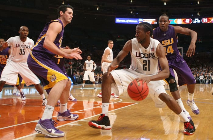 UConn's Stanley Robinson dribbles the ball in a game.