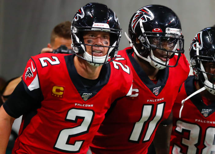 Matt Ryan and Julio Jones run onto the field for the Atlanta Falcons.