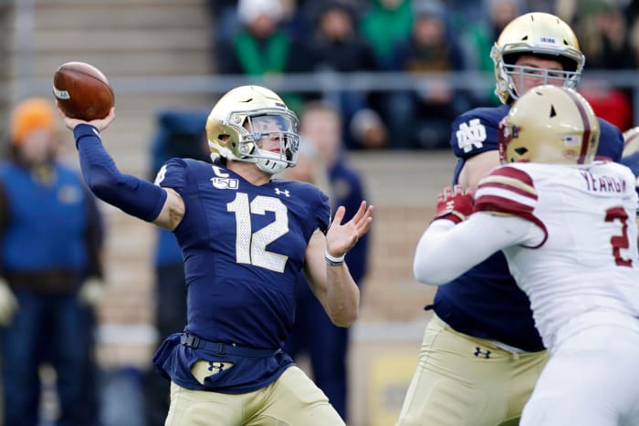 Notre Dame QB Ian Book throwing vs. Boston College during a 2019 college football game.