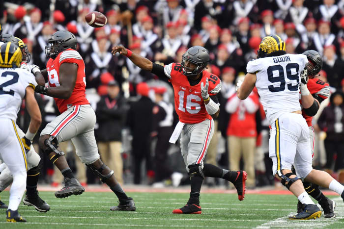 J.T. Barrett throwing a pass against Michigan.